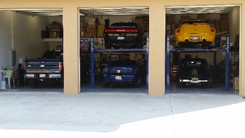 BendPak HD9XW 4 post lifts in home garage